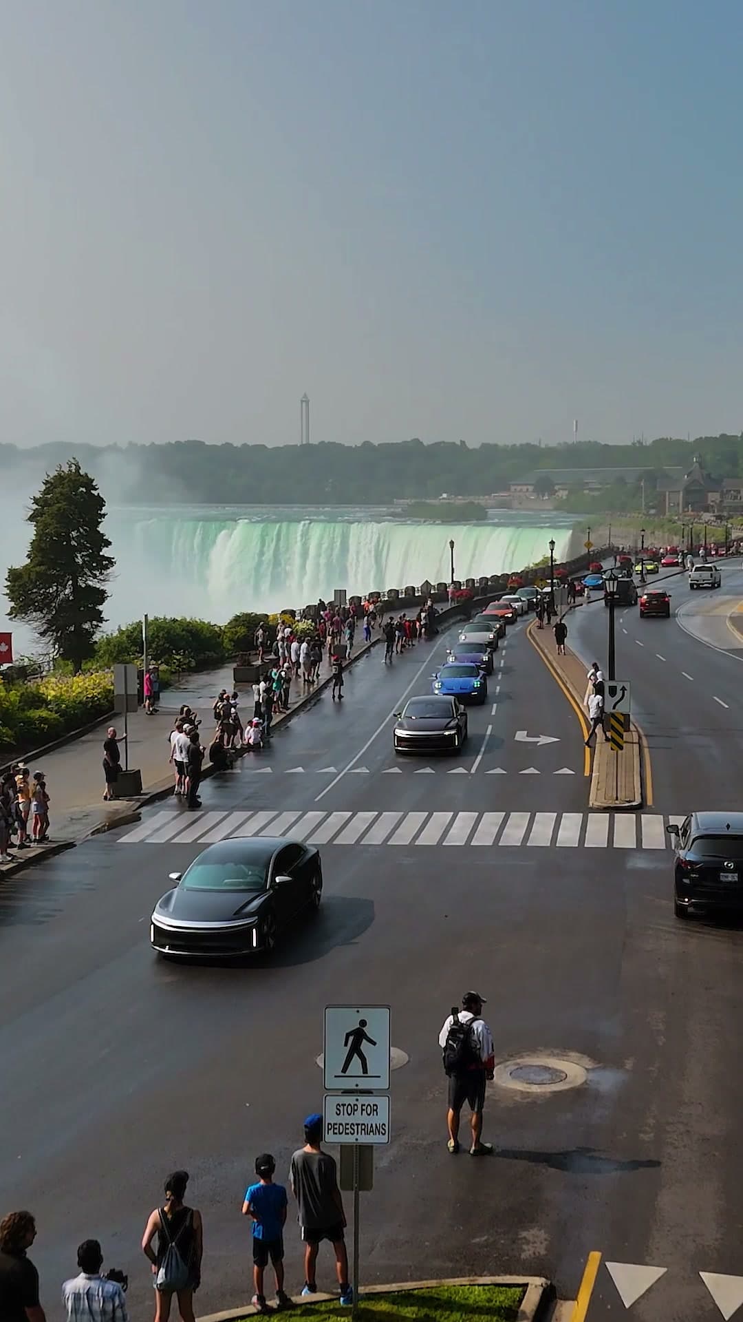 Supercars crossing in front of Horseshoe Falls