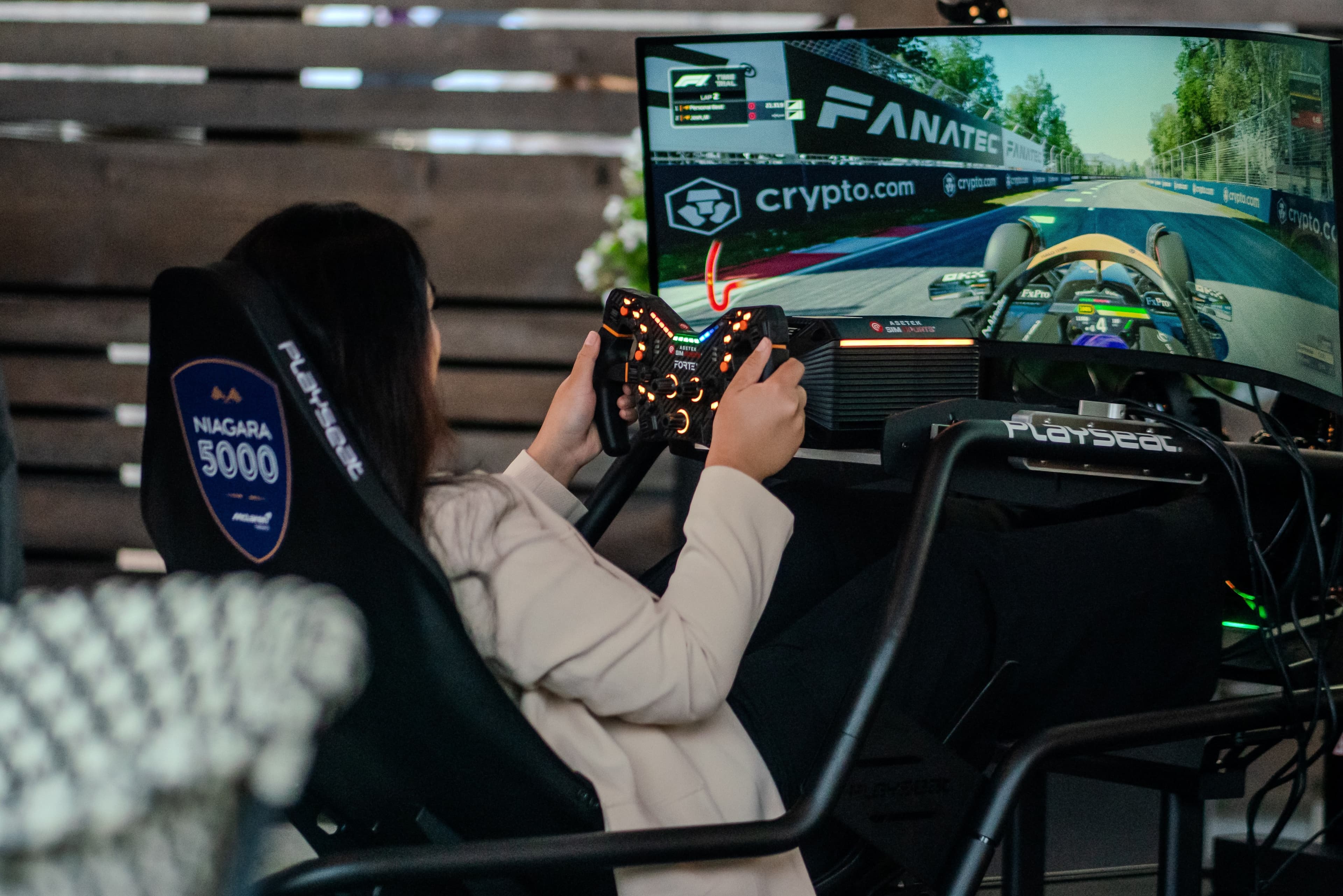 Guest driving a Niagara 5000 branded Playseat F1 racing simulator