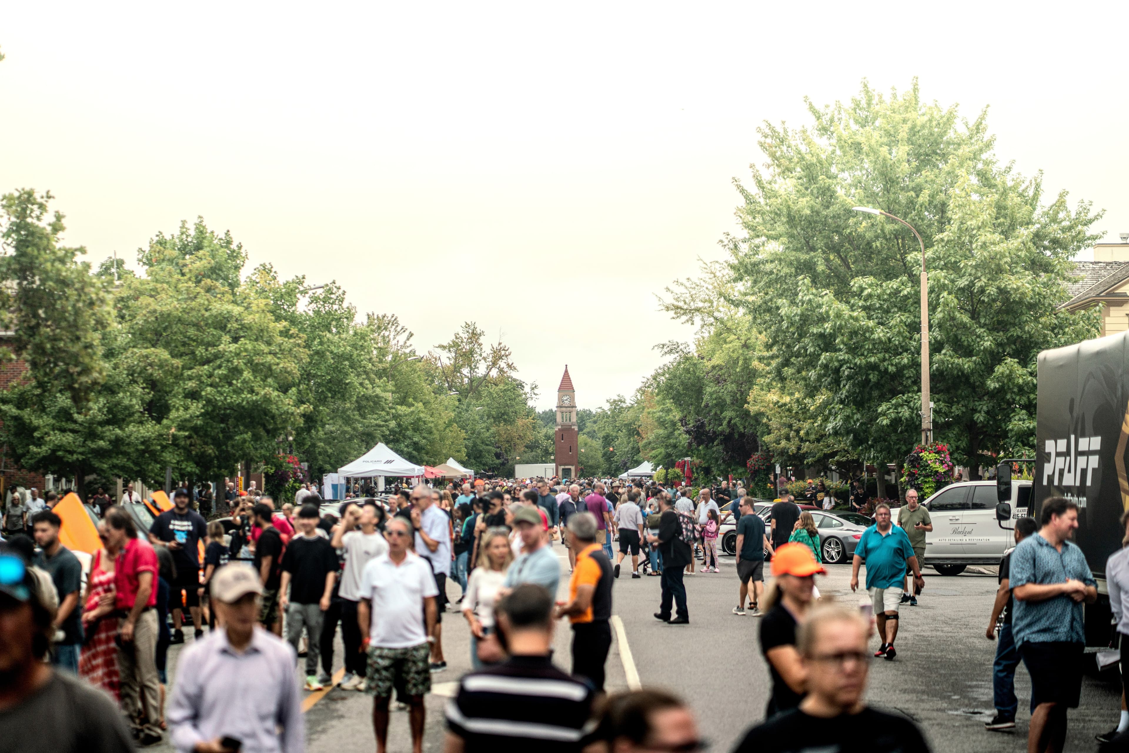 Crowds fill Queen Street past the clock tower at the supercar show