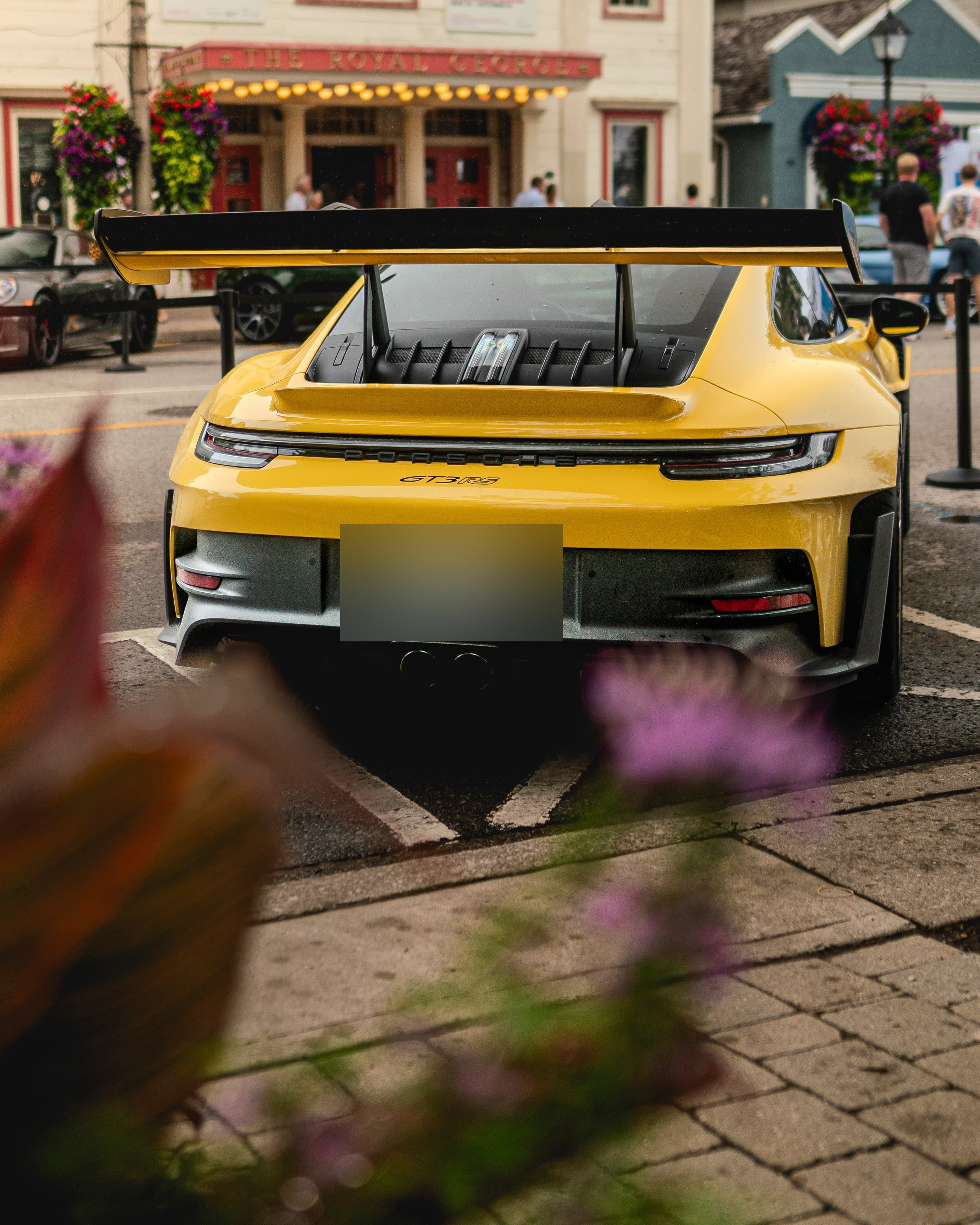 Yellow Porsche 911 GT3 RS parked outside the Royal George Theatre